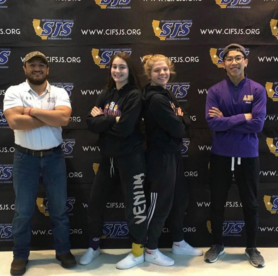 Ashlee and Morgan, flanked by their coaches, show off Royal pride.