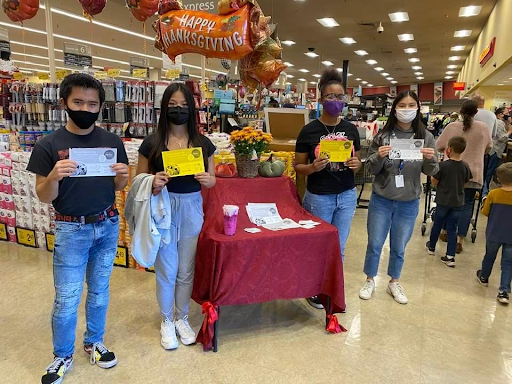 Customers at Safeway on Waterman Blvd. were asked to help feed the hungry by Cristian Diaz, Sophia de Guzman, Alayna Adkins and Phoebe McDonald.