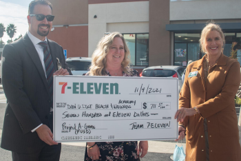 Superintendent Kris Corey, Director of Elementary Education Ryan Gonzales, Principal of Dan O. Root II Health and Wellness Academy Julie Reece accept a grant from 7-Eleven.