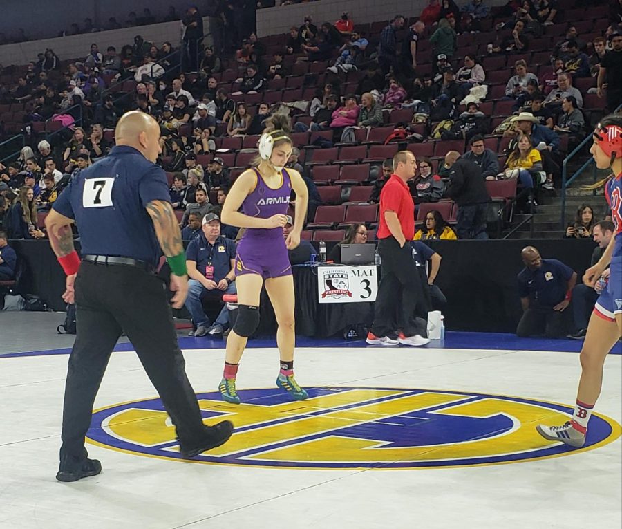 Ashlee is poised and ready to wrestle.