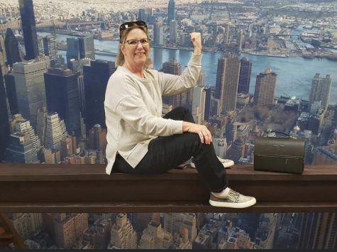 Ms. Anderson is on top of the world at the Construction Fair.