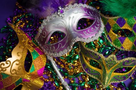 Masks, floats, and beads contribute to the party atmosphere.