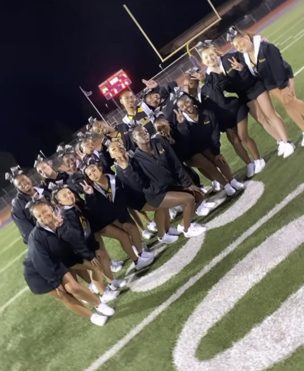 The Armijo cheer team poses for a picture after cheering on the football team to victory