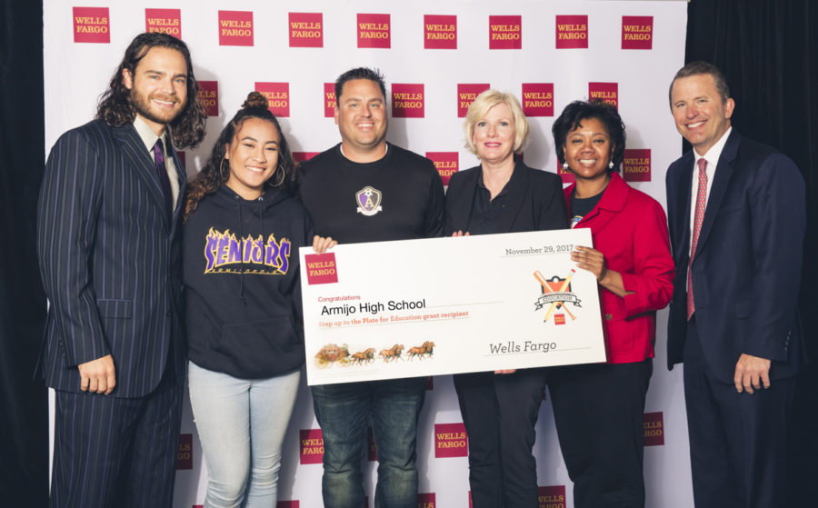 Leadership teacher Brad Burzynski, Principal Sheila Smith and Special Education teacher Michelle Bolden  (3rd, 4th and 5th from left) are joined by others to accept the grant from Wells Fargo.