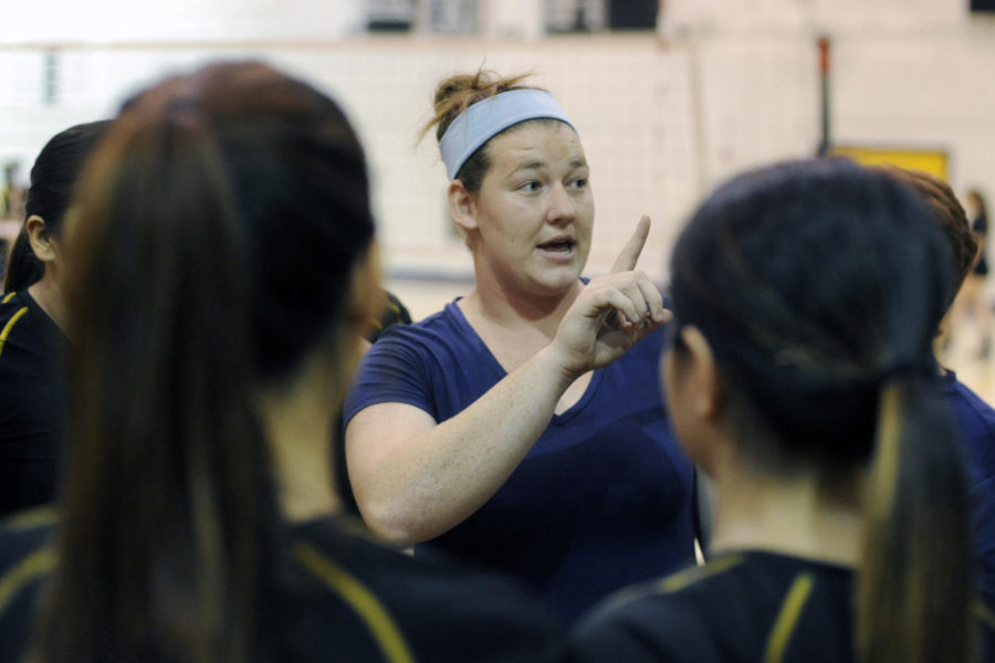 Armijo volleyball coach Paige McConlogue speaks to her team before the match against Vacaville at Armijo High School in Fairfield, Thursday. (Aaron Rosenblatt/Daily Republic)