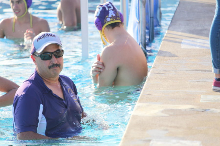 Water Polo Coach doing his job.