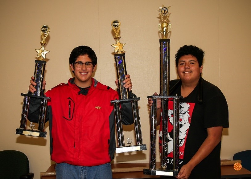 Armijo student John Salazar and fellow PAL member Erick Granados Avilez show off their trophies.