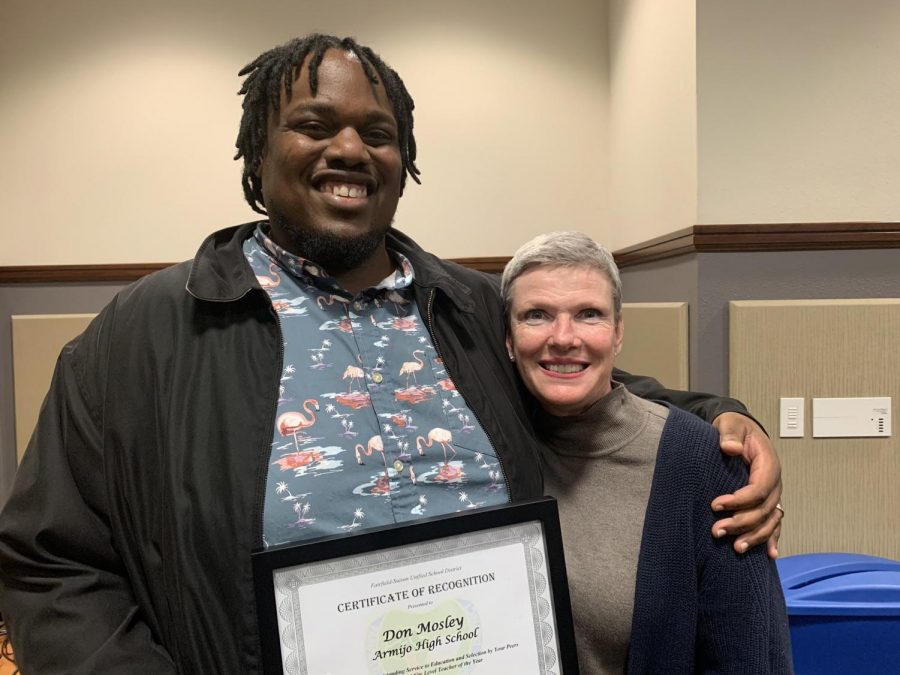 Last year's Teacher of the Year, Don Mosley, is this year's Varsity football coach.