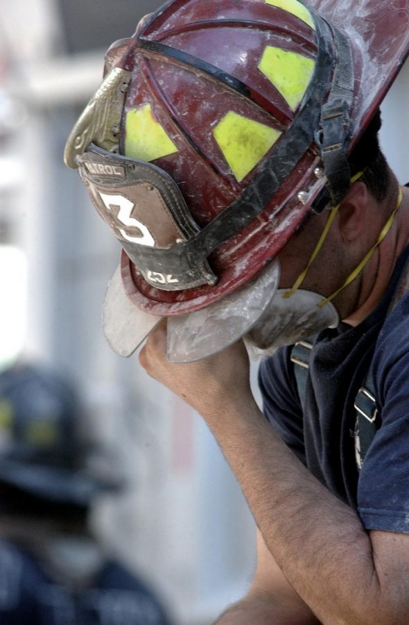 Although tired, firefighters keep working.