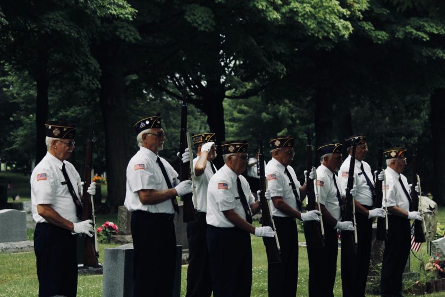 Military honors are recognized through a 21-gun salute.