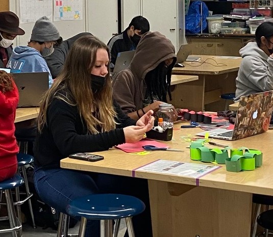 Leilani Barnes and Taliya Gossett Salahudeen focus on creating simple toys for project.