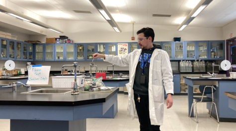 Mr. Smith demonstrates one of the classs projects.