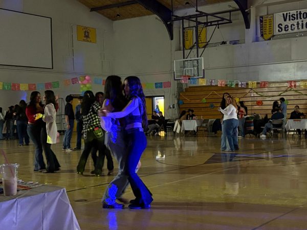 Pair of students on the dance floor enjoying the music and making new memories