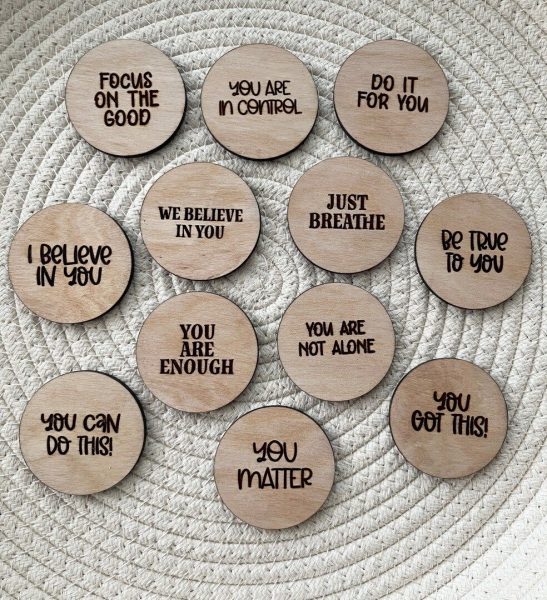 Little wooden signs spreading positivity for those who need it.
